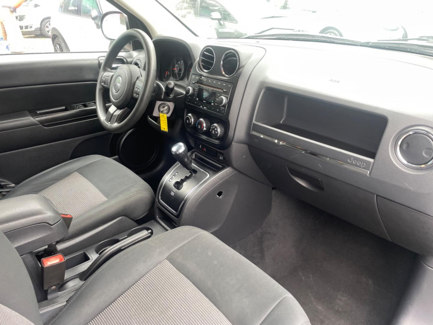 2012 SILVER JEEP COMPASS SPORT (1C4NJCBA8CD) with an 2.0L engine, Continuously Variable transmission, located at 5103 Dorchester Rd., Charleston, SC, 29418-5607, (843) 767-1122, 36.245171, -115.228050 - Spacious Interior with CD/AUX/AM/FM, Hands-free Phone, Power Windows, Power Locks, Power Windows, Power Mirrors, Keyless Entry, Alloy Wheels. Local Trade-in!! 108k miles Located at New Life Auto Sales! 2023 WINNER for Post & Courier's Charleston's Choice Pre-owned Car Dealer AND 2018-2024 Top 5 Fin - Photo#8